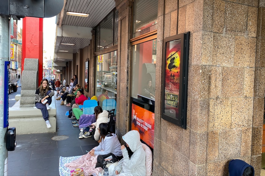 People sitting on the ground.