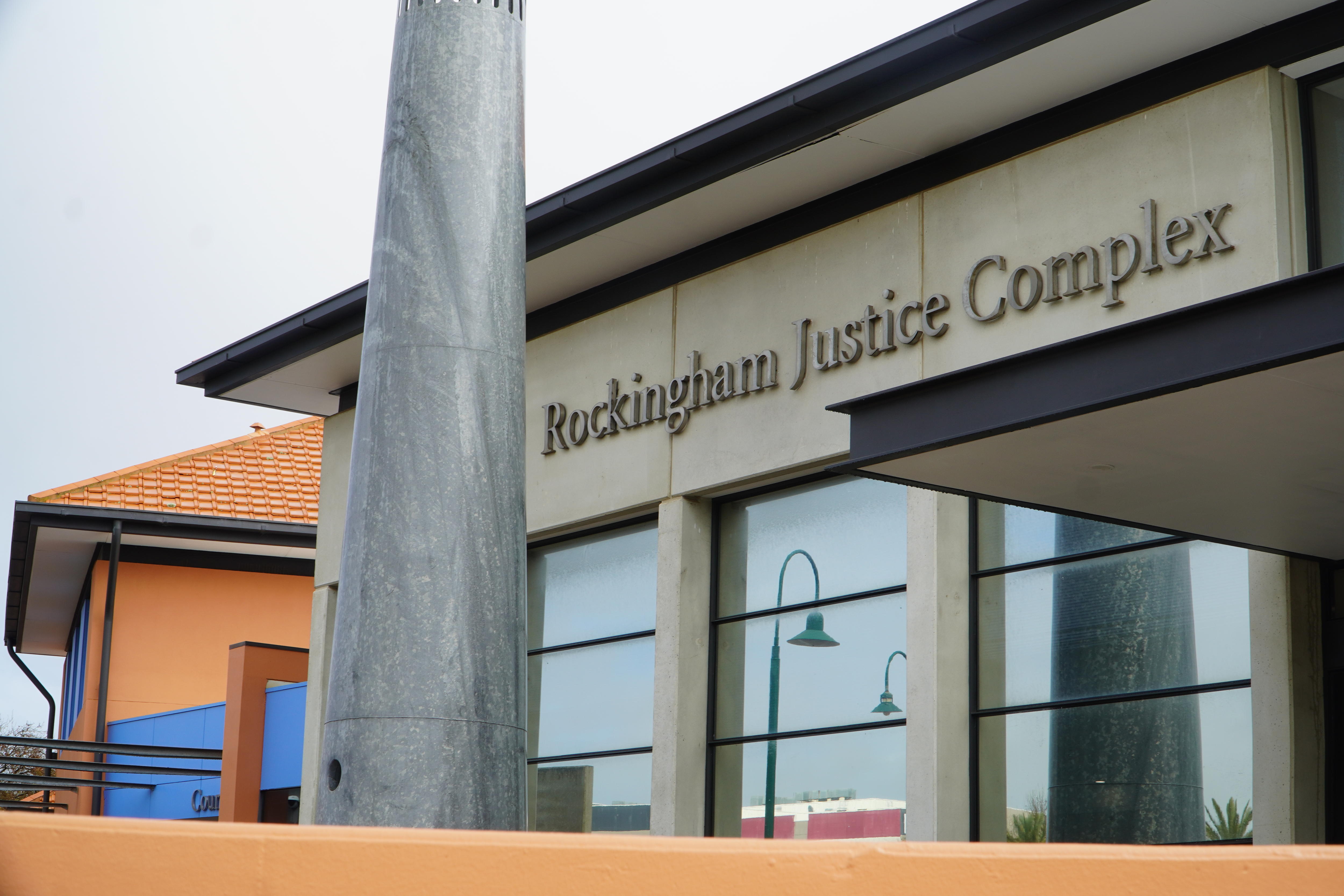 A building with the words 'Rockingham Justice Complex' on the outside.