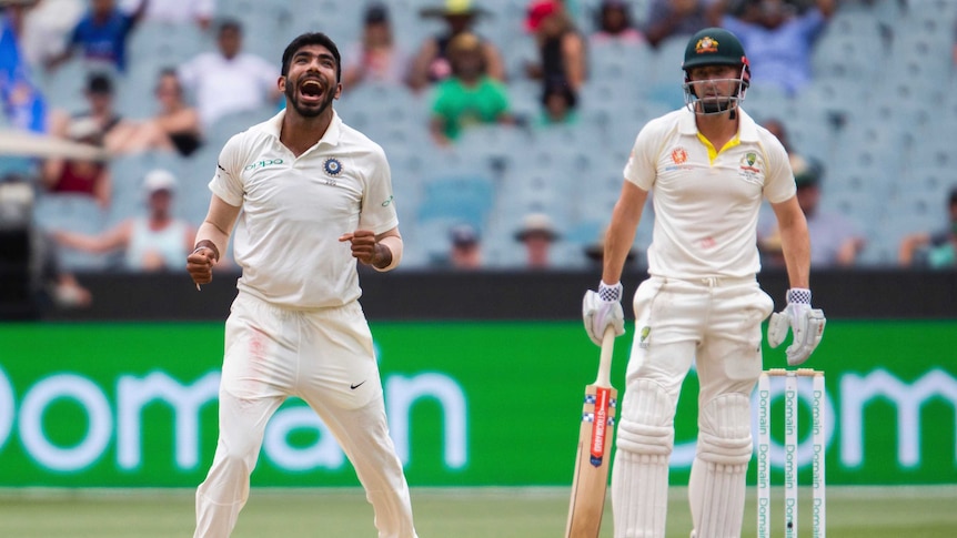 Jasprit Bumrah looks upwards and celebrates the wicket of Shaun Marsh, as the batsman looks on dejectedly