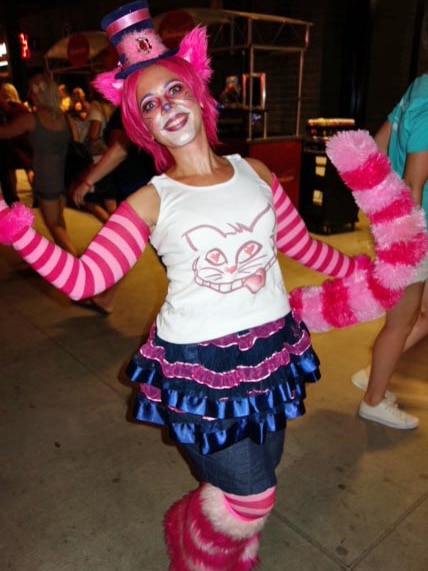 A cat lover dressed as the Cheshire cat from Alice in Wonderland.