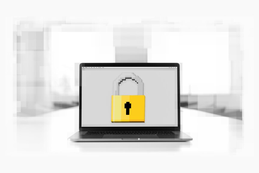 A black and white image of a laptop with a colour pixelated icon of a large padlock on it's screen.