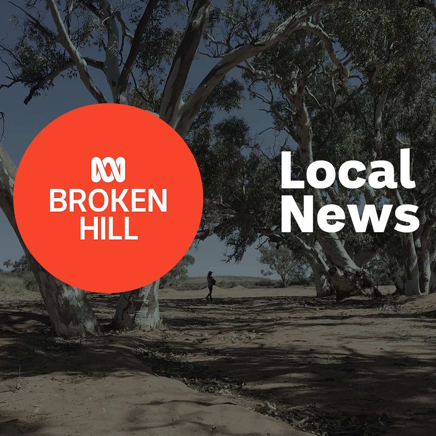 Dry riverbed with giant gum trees; ABC Broken Hill and Local News superimposed over the top.