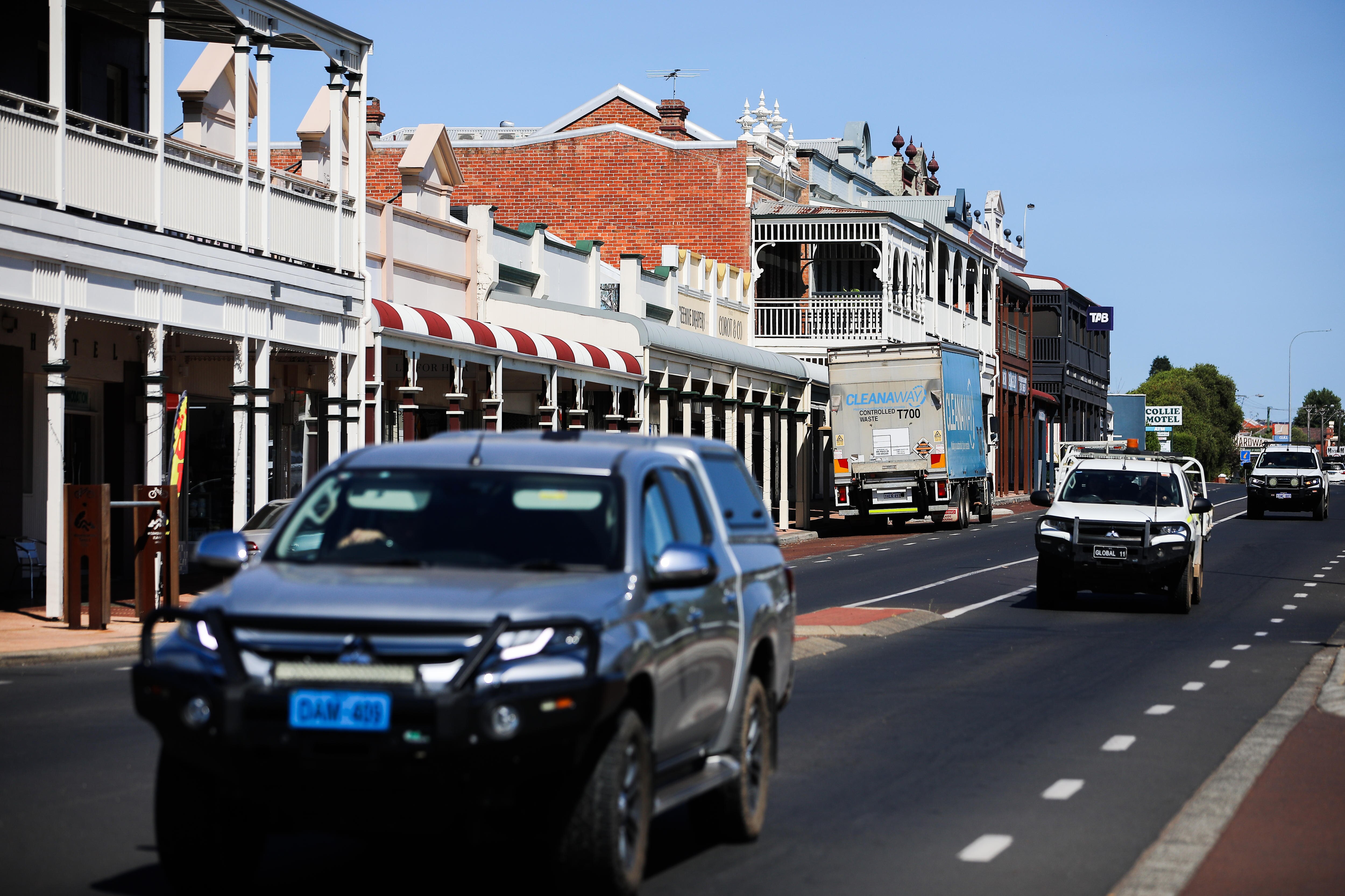 A car runs on the main street of a local city