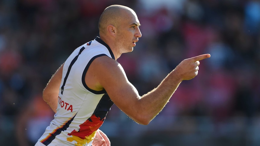 James Podsiadly celebrates a goal for the Crows