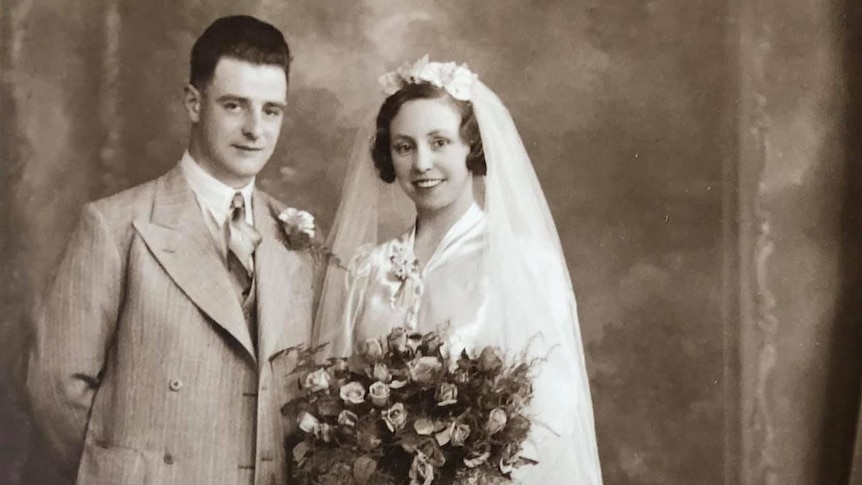 An old sepia photo of a bride and groom. 