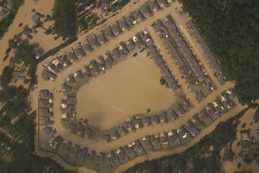 A lakeside housing estate in Louisiana is swamped by floodwaters.