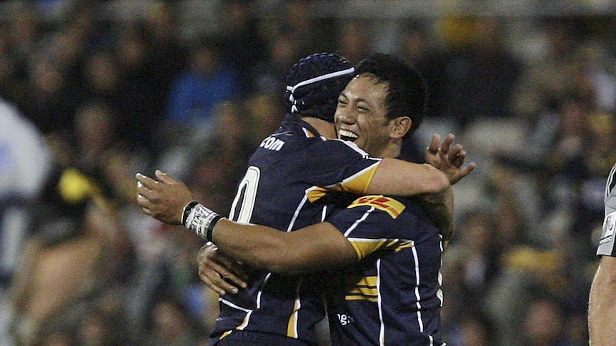 On target ... Matt Giteau (l) and Christian Lealiifano celebrate snapping the Brumbies' five-game losing skid.