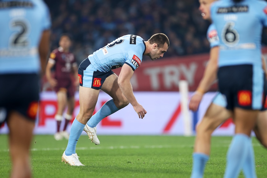 NSW Blues player Isaah Yeo stumbles as he runs during State of Origin I.