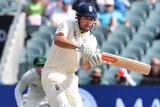 Alastair Cook attempts to play a pull shot against Australia at Adelaide Oval.