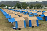 cream and blue tents stacked close together 