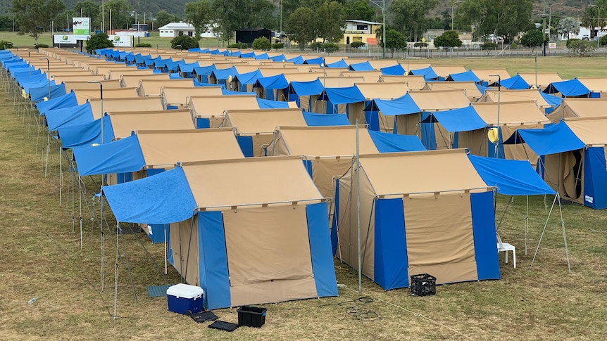 cream and blue tents stacked close together 