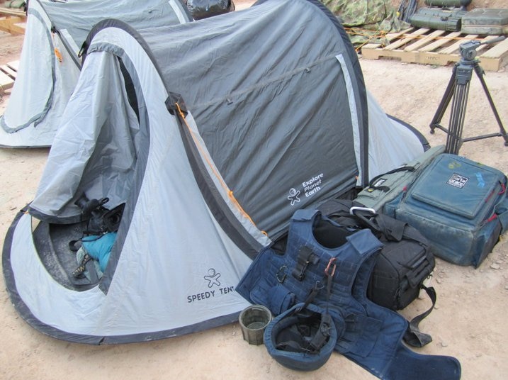 Tent with equipment stored next to it.