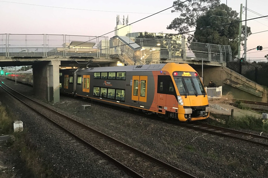 A Cityrail train under the overhead bridge at Kingsgrove Station in Sydney's south.