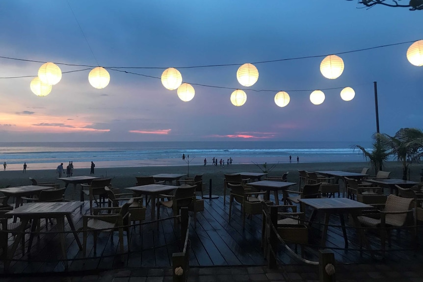 A view of a beach at dusk in Seminyak in Bali
