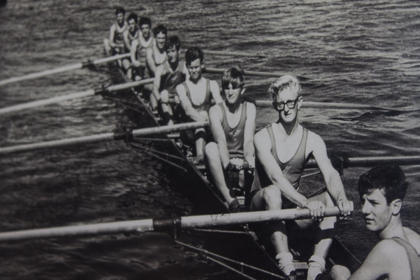 John Vos rowing as a teenager in the front of the boat