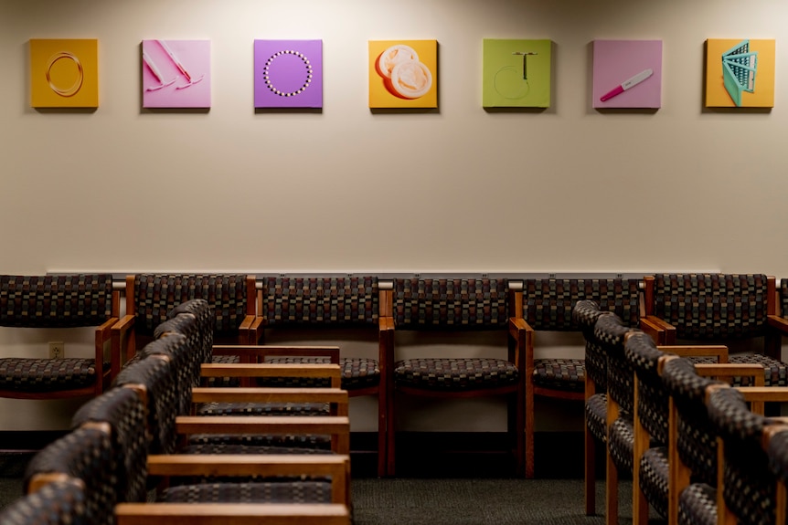 Empty chairs in a waiting room.