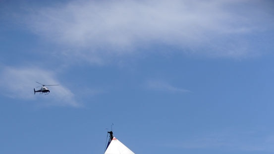 Skandia is surrounded by spectator craft in the Sydney to Hobart