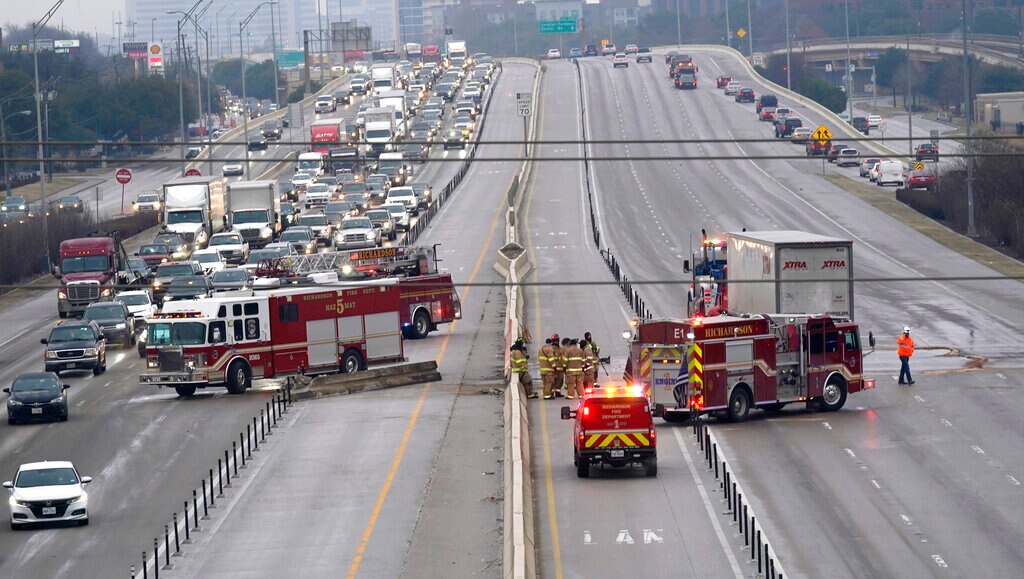 The highway sits closed as emergency crews finish cleaning following accidents caused by ice and low temperatures