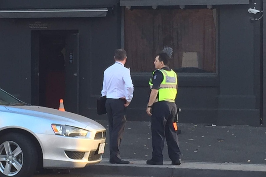 Police officers outside Kittens strip club, South Melbourne