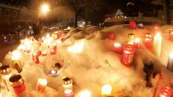 Search off: candles are lit to pay respect to the victims of the ice rink collapse.