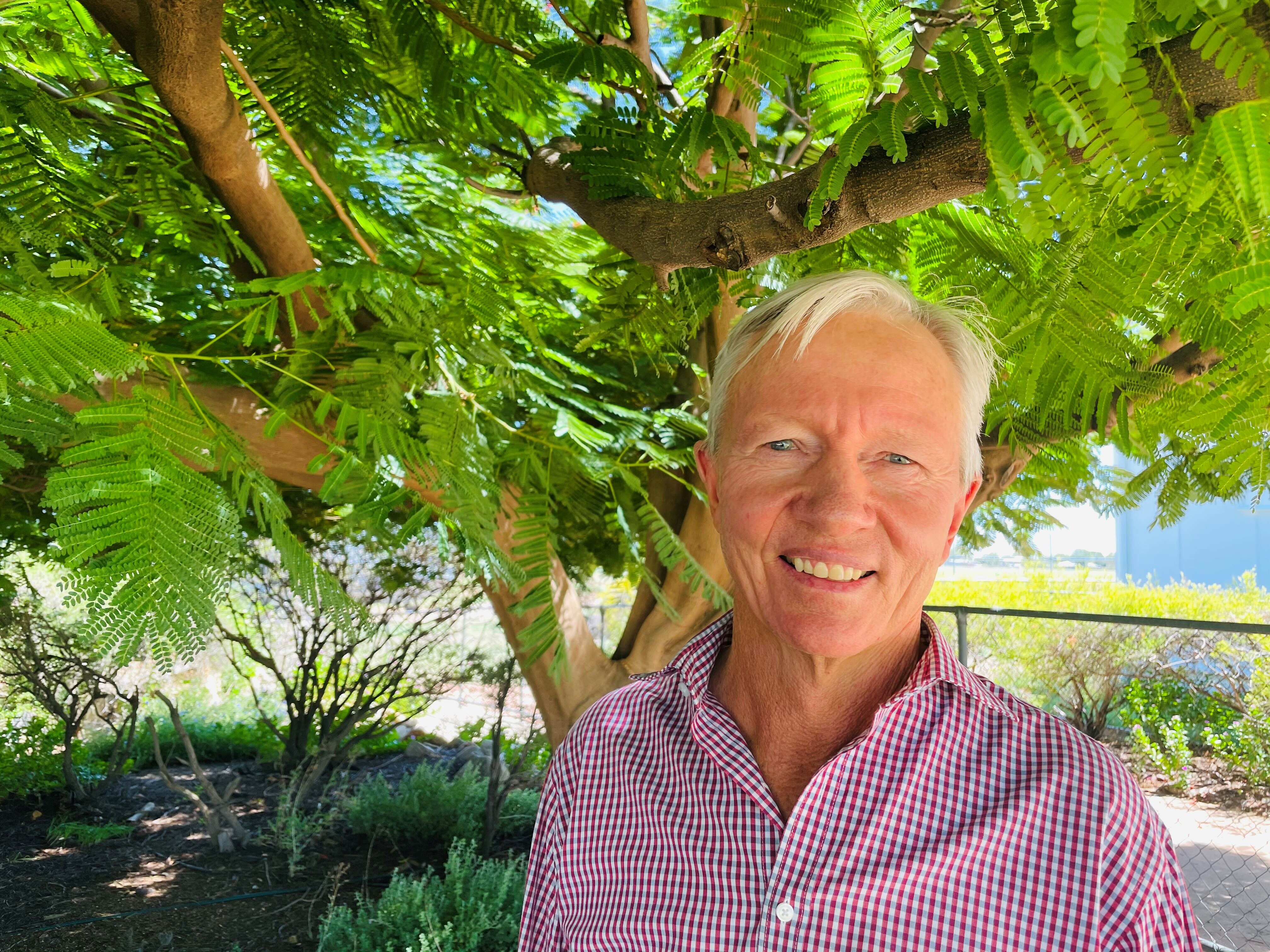 Ilfracombe grazier Sandy Williams standing in front of green trees
