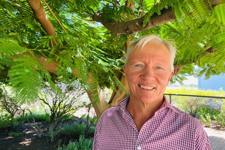 Ilfracombe grazier Sandy Williams standing in front of green trees