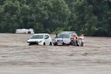 Campers being rescued in flood water.