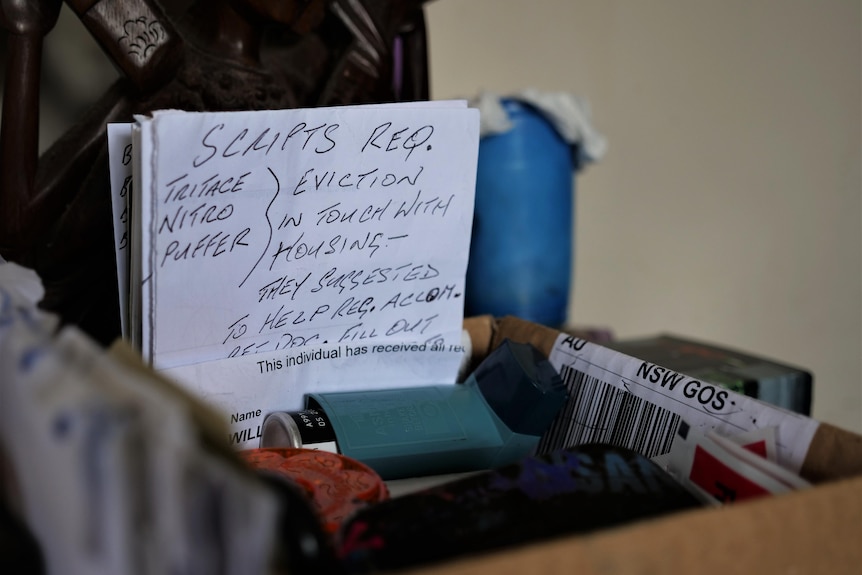 A handwritten note on the kitchen table that says eviction, in touch with housing