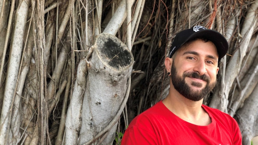 Michael "Triki" Trikilis standing in front of a banyan tree in Darwin.