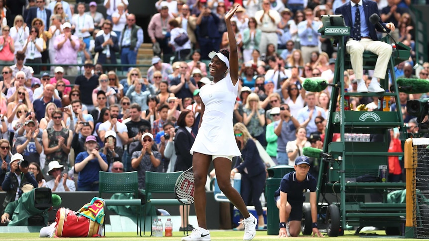 Venus Williams waves to the Wimbledon crowd