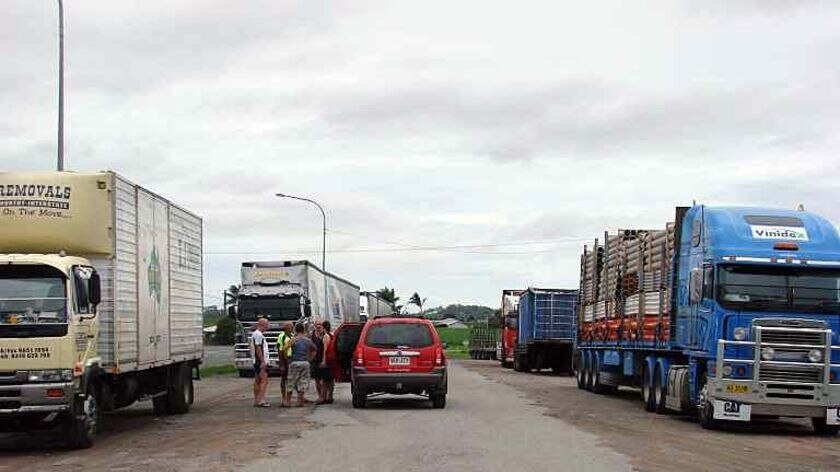 Trucks sit by the side of the road in Hampden