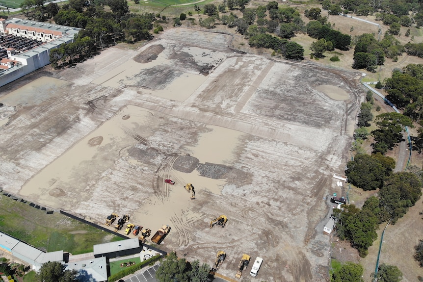 An empty plot of land with heavy machinery