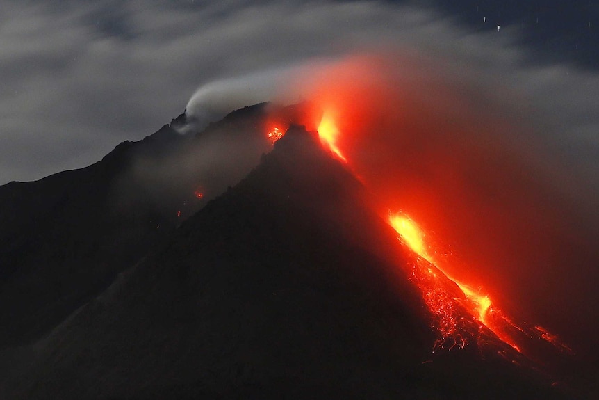 Hot lava flows from Mount Sinabung volcano in 2015