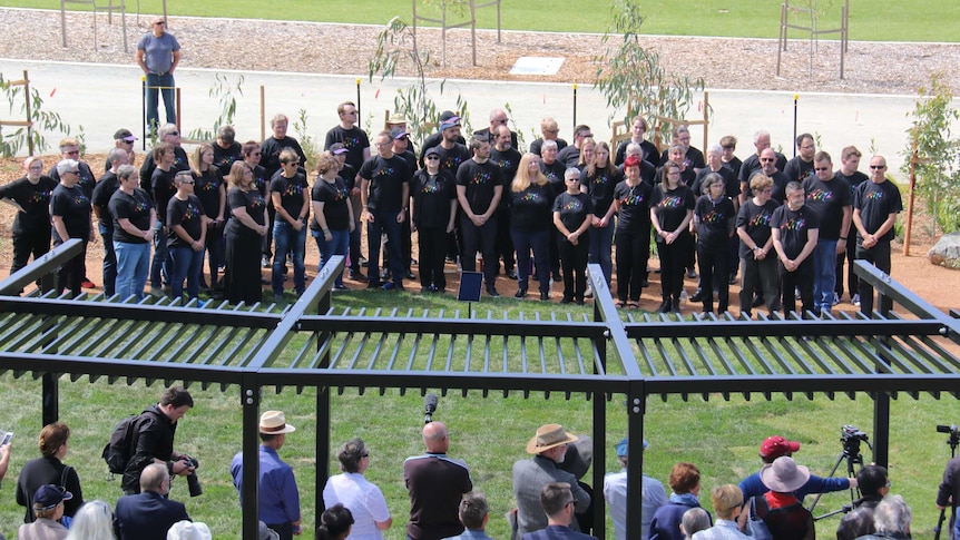 Canberra's choir, Qwire, sings at the opening of the AIDS Garden of Reflection.