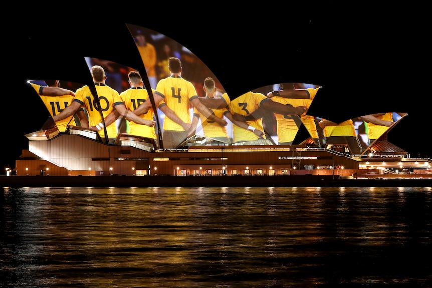 Players from Australia's national rugby union team, the Wallabies, are projected onto the Sydney Opera House.