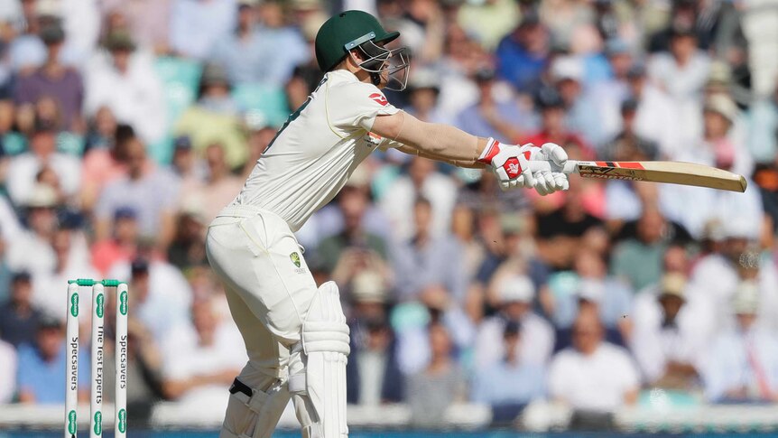 David Warner reaches a long way outside his off stump and flashes the bat at the ball.