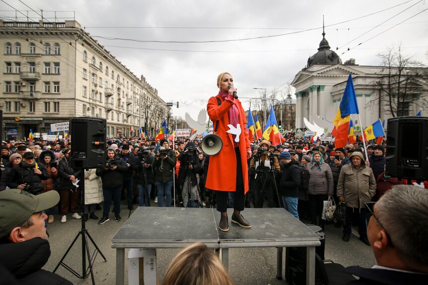 Marina Tauber the vice-president of Moldova's Russia-friendly Shor Party speaks through a megaphone during a protest.