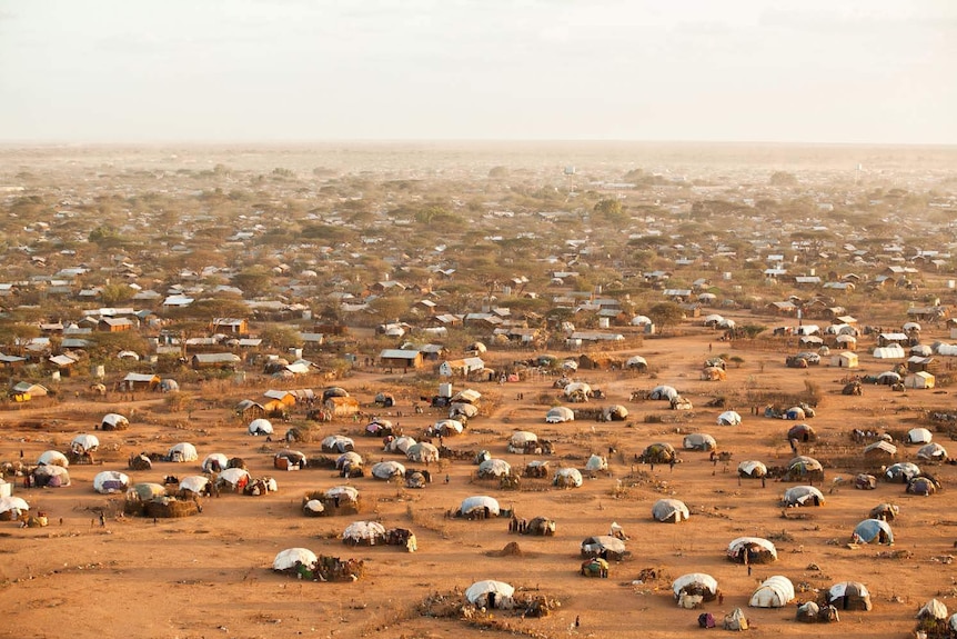 Aerial shot of the UNHCR Refugee camp in Dadaab in Kenya, with hundreds of tents in the desert.
