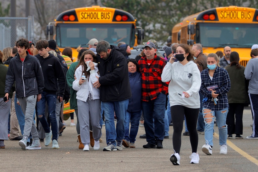 Parents leave with students after Oxford High School Shooting