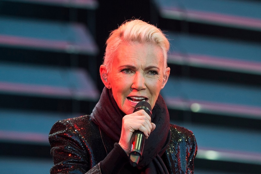 Marie Fredriksson, singer of the pop duo Roxette singing on stage.