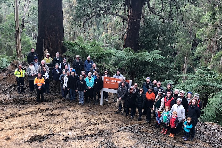 A large group of people in the forest.