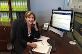 Australian Taxation Office assistant commissioner Kath Anderson on the phone