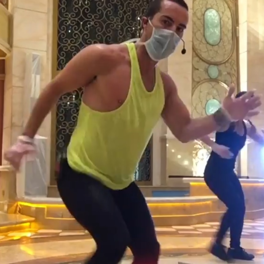 A man with a face mask does exercise