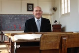 Principal Mick Davy sits in Hagley Farm School's oldest classroom