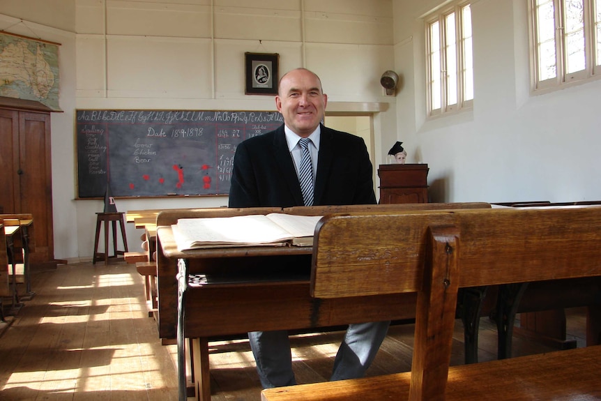 Principal Mick Davy sits in Hagley Farm School's oldest classroom