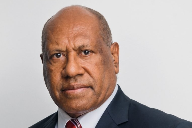 A close-up headshot of the former deputy pm of png