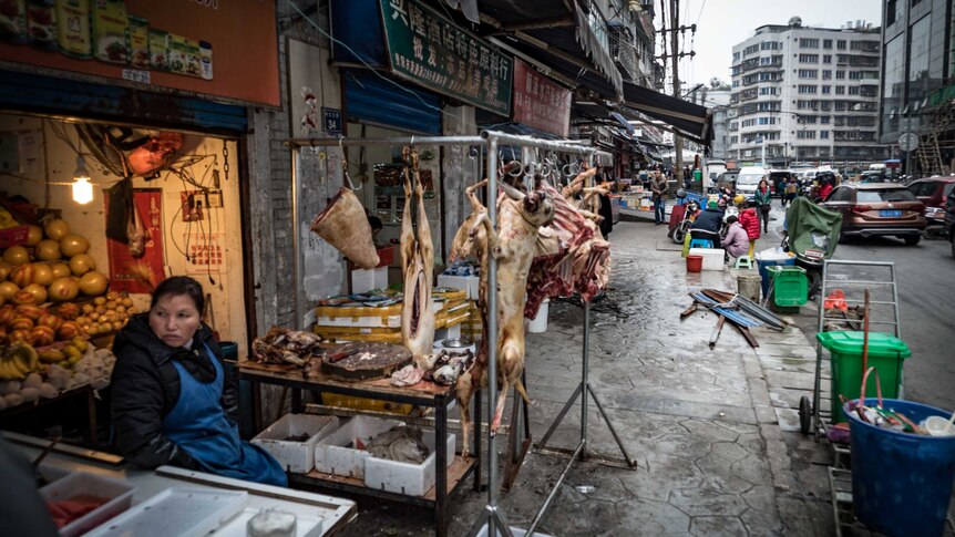 Chinese street scene with dog meat for sale