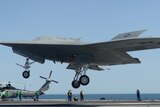X-47B drone prepares to execute a touch and go on aircraft carrier