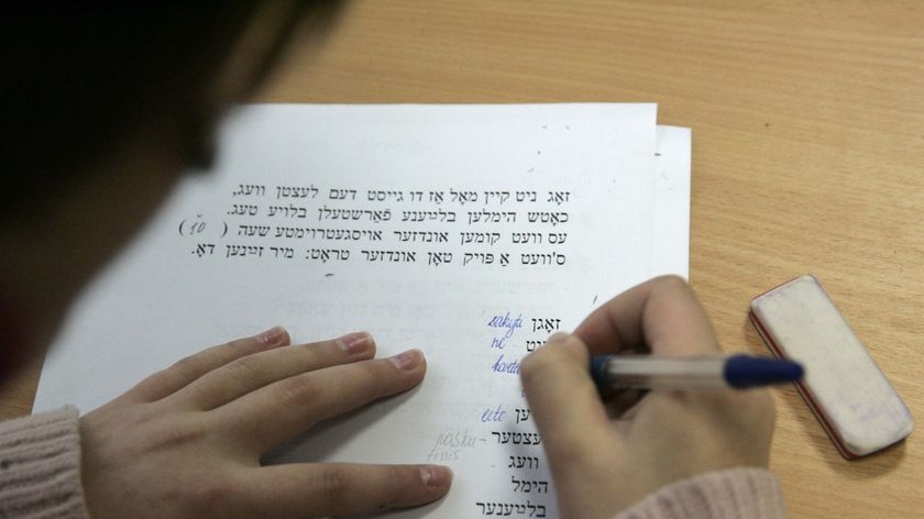 A secondary school student learns Yiddish during a lesson of Jewish history and culture