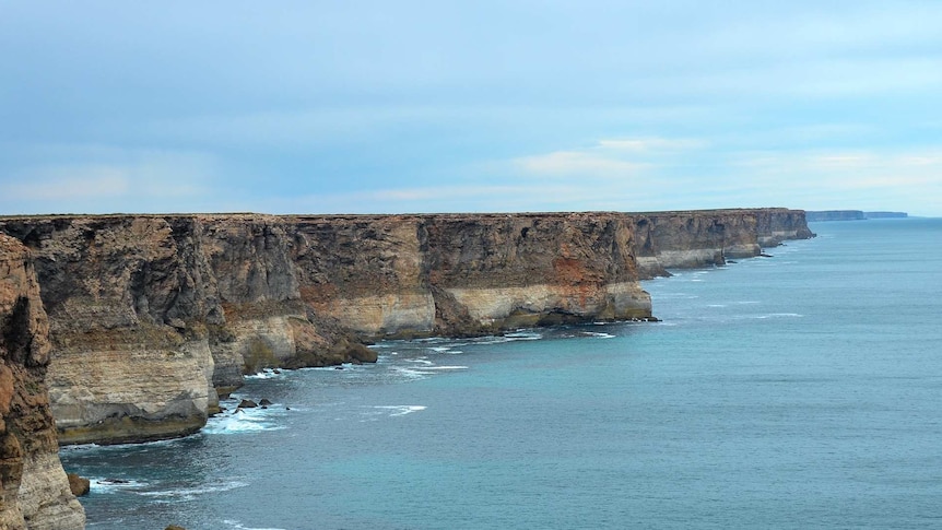 The long cliff face of the Great Australian Bight with sky above and sea below